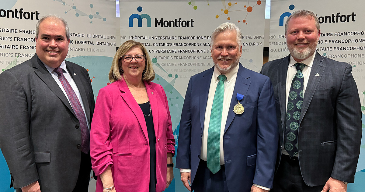 Hôpital Montfort representatives surrounding Dr. Bernard Leduc